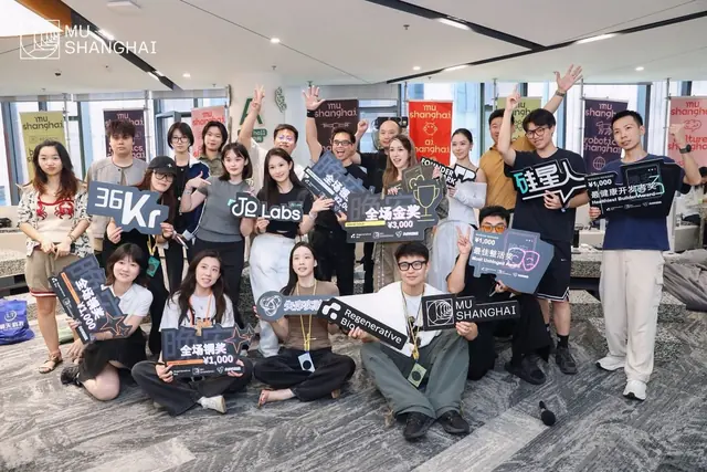 Participants celebrating at the Good Night, Hackers hackathon